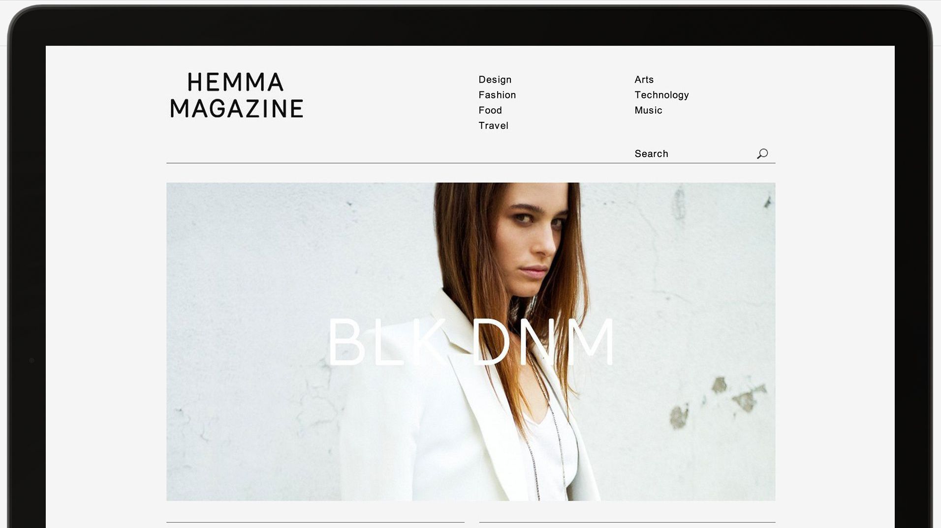 The Hemma Magazine home page displayed within a laptop screen.