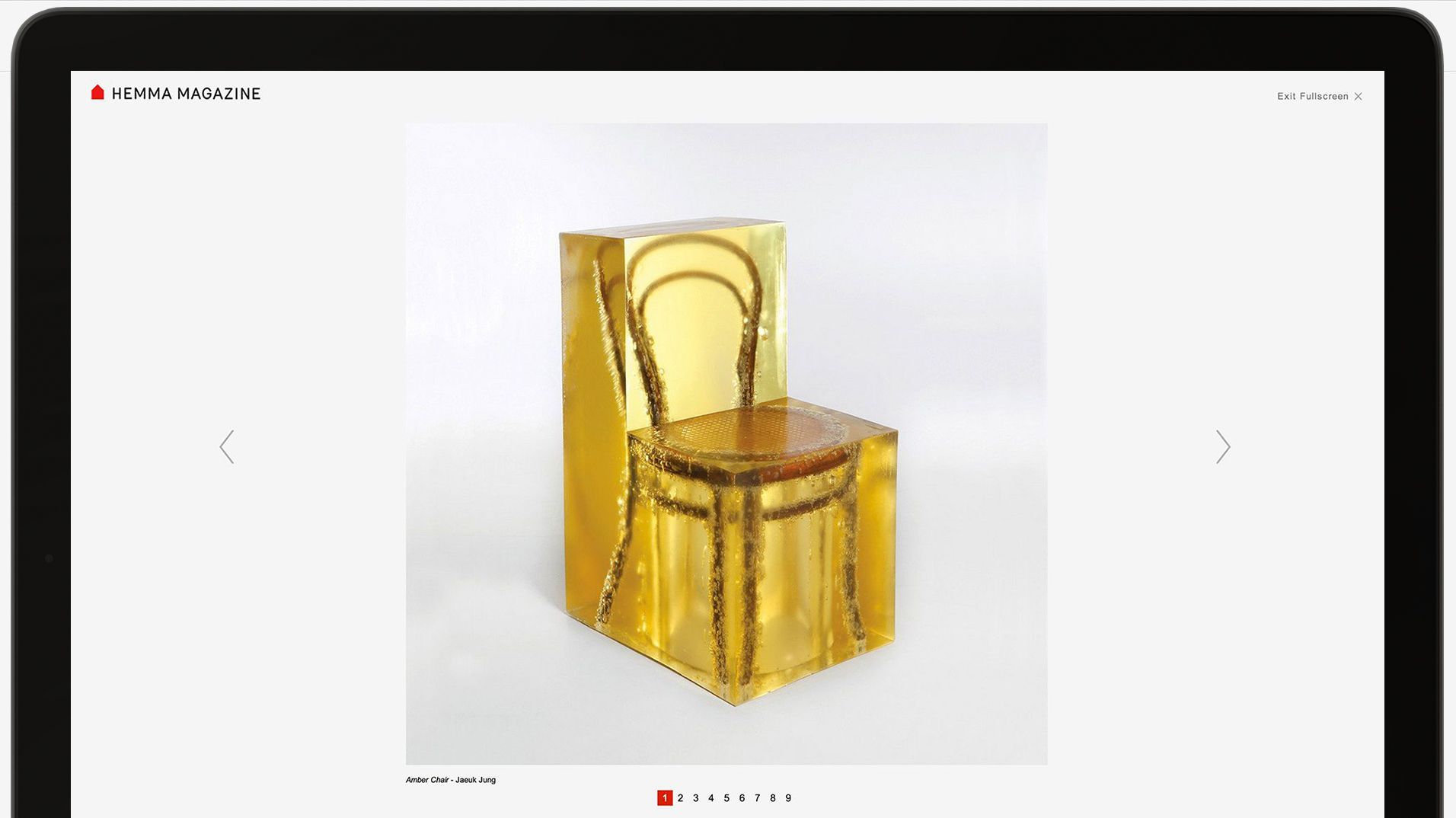 The website image viewer showing the gold chair against a white background.