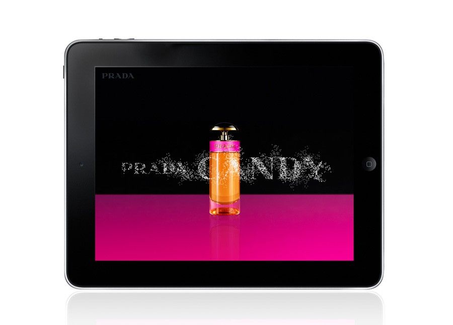 The Prada Candy launch screen displayed on a black tablet.